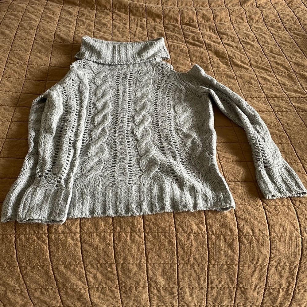 Cliche turtleneck cable sweater with open shoulders